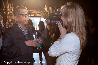 Mercedes-Benz New York Fashion Week 2010 Tadashi Shoji being interviewed by Cheryl Bemis of Fashionably Austin.