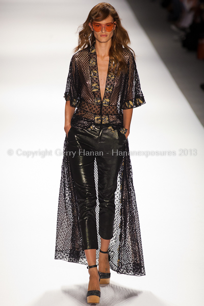 A model on the runway at the Custo Barcelona SS2013 show at New York Mercedes-Benz Fashion Week.