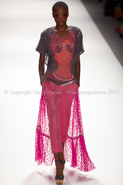 A model on the runway at the Custo Barcelona SS2013 show at New York Mercedes-Benz Fashion Week.