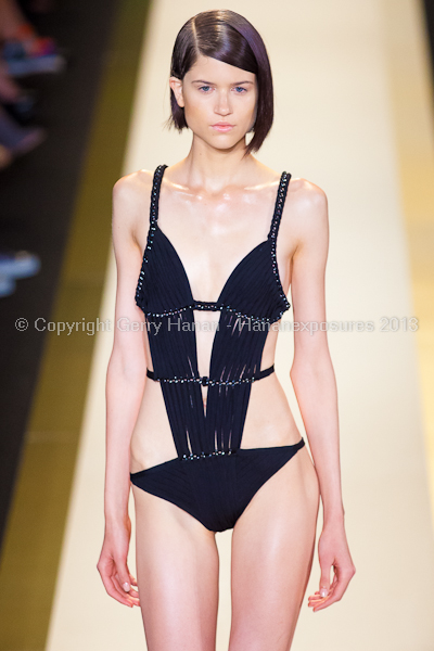 A model on the runway at the Herve Leger SS2013 show at New York Mercedes-Benz Fashion Week.