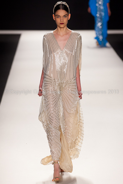 A model on the runway at the Naeem Khan SS2013 show at New York Mercedes-Benz Fashion Week.