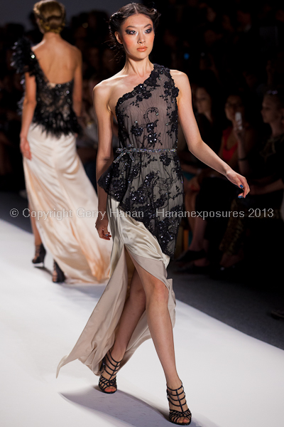 A model on the runway at the Venexiana SS2013 show at New York Mercedes-Benz Fashion Week.