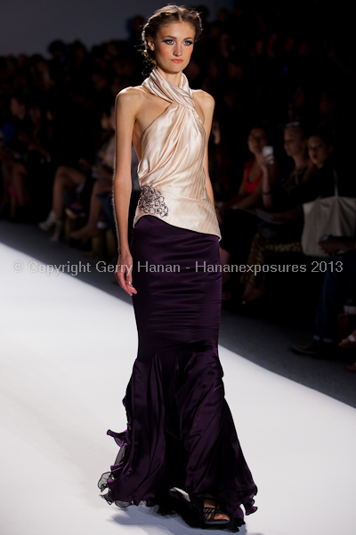 A model on the runway at the Venexiana SS2013 show at New York Mercedes-Benz Fashion Week.