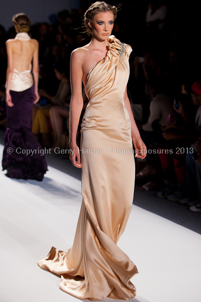 A model on the runway at the Venexiana SS2013 show at New York Mercedes-Benz Fashion Week.