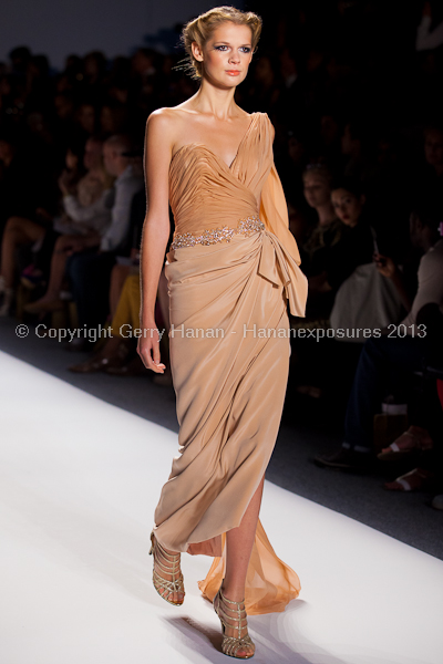 A model on the runway at the Venexiana SS2013 show at New York Mercedes-Benz Fashion Week.