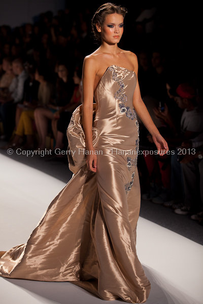 A model on the runway at the Venexiana SS2013 show at New York Mercedes-Benz Fashion Week.