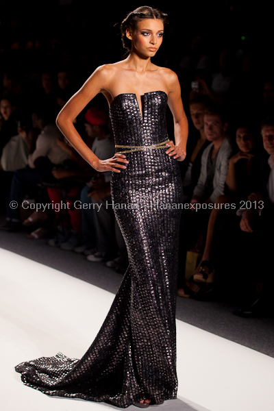 A model on the runway at the Venexiana SS2013 show at New York Mercedes-Benz Fashion Week.