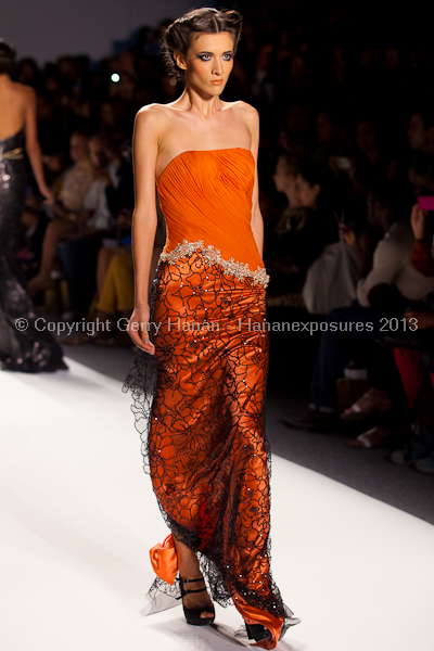 A model on the runway at the Venexiana SS2013 show at New York Mercedes-Benz Fashion Week.