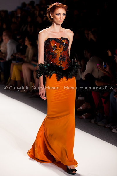 A model on the runway at the Venexiana SS2013 show at New York Mercedes-Benz Fashion Week.