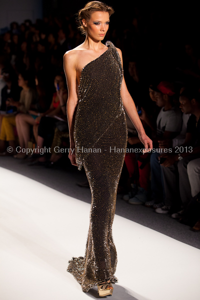 A model on the runway at the Venexiana SS2013 show at New York Mercedes-Benz Fashion Week.