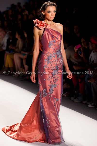 A model on the runway at the Venexiana SS2013 show at New York Mercedes-Benz Fashion Week.