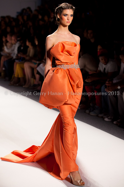 A model on the runway at the Venexiana SS2013 show at New York Mercedes-Benz Fashion Week.