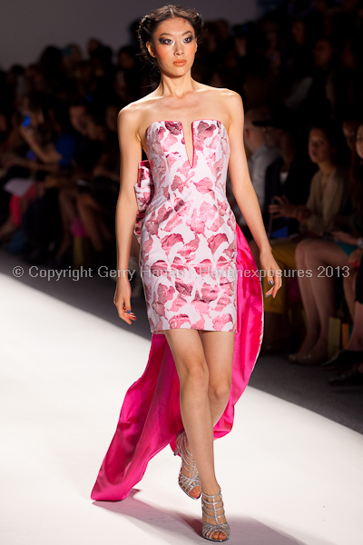 A model on the runway at the Venexiana SS2013 show at New York Mercedes-Benz Fashion Week.