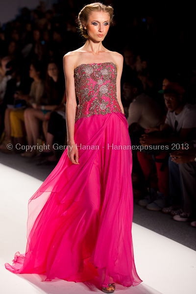 A model on the runway at the Venexiana SS2013 show at New York Mercedes-Benz Fashion Week.