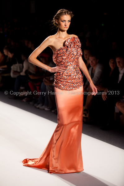 A model on the runway at the Venexiana SS2013 show at New York Mercedes-Benz Fashion Week.