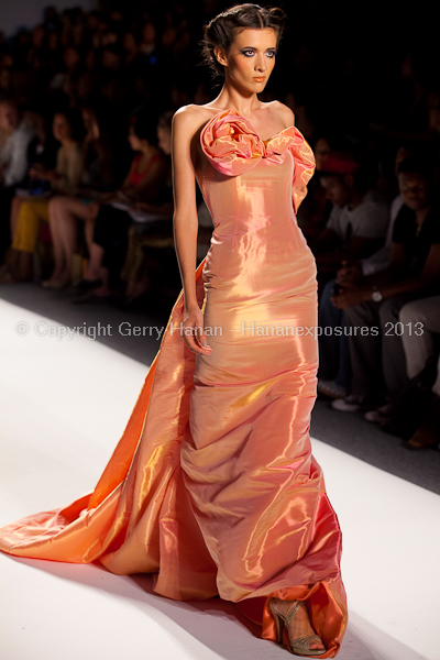 A model on the runway at the Venexiana SS2013 show at New York Mercedes-Benz Fashion Week.