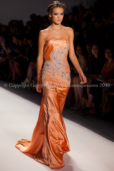 A model on the runway at the Venexiana SS2013 show at New York Mercedes-Benz Fashion Week.