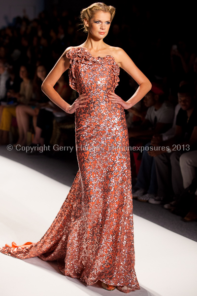 A model on the runway at the Venexiana SS2013 show at New York Mercedes-Benz Fashion Week.