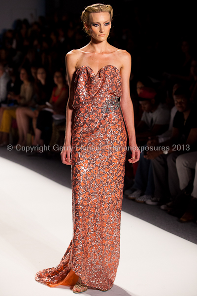 A model on the runway at the Venexiana SS2013 show at New York Mercedes-Benz Fashion Week.