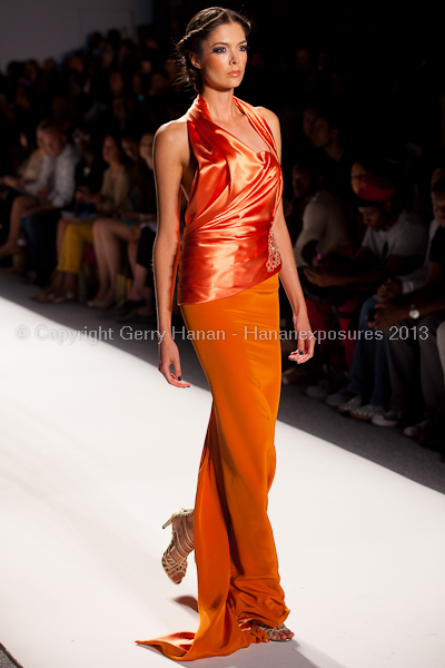 A model on the runway at the Venexiana SS2013 show at New York Mercedes-Benz Fashion Week.