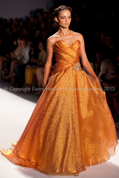 A model on the runway at the Venexiana SS2013 show at New York Mercedes-Benz Fashion Week.