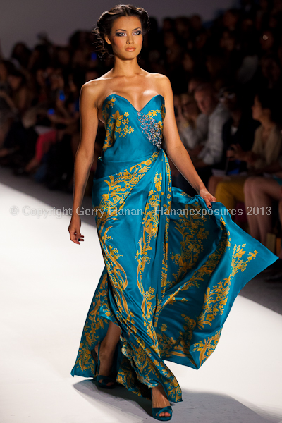 A model on the runway at the Venexiana SS2013 show at New York Mercedes-Benz Fashion Week.