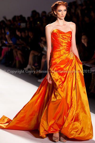 A model on the runway at the Venexiana SS2013 show at New York Mercedes-Benz Fashion Week.