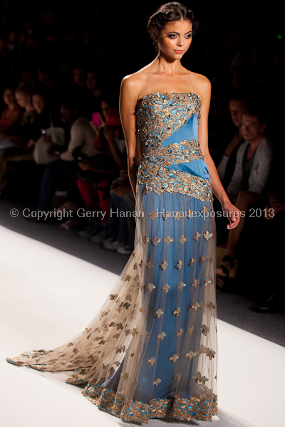 A model on the runway at the Venexiana SS2013 show at New York Mercedes-Benz Fashion Week.