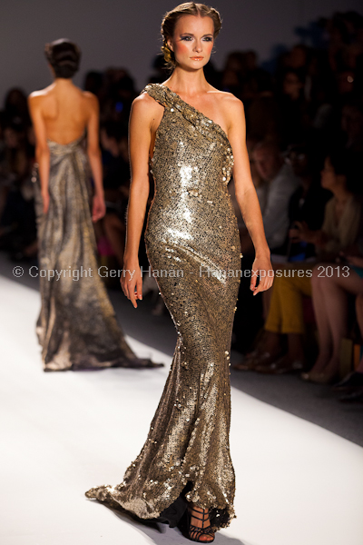 A model on the runway at the Venexiana SS2013 show at New York Mercedes-Benz Fashion Week.