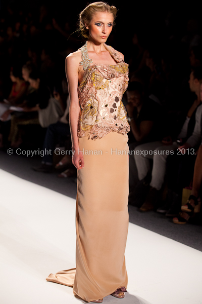 A model on the runway at the Venexiana SS2013 show at New York Mercedes-Benz Fashion Week.