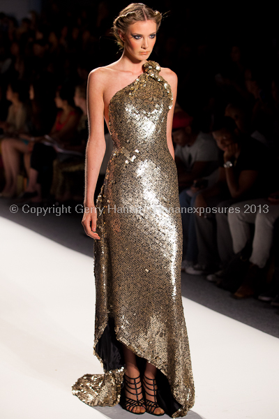 A model on the runway at the Venexiana SS2013 show at New York Mercedes-Benz Fashion Week.