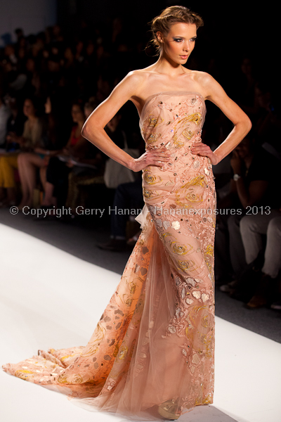 A model on the runway at the Venexiana SS2013 show at New York Mercedes-Benz Fashion Week.