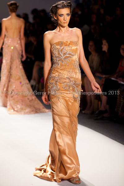 A model on the runway at the Venexiana SS2013 show at New York Mercedes-Benz Fashion Week.