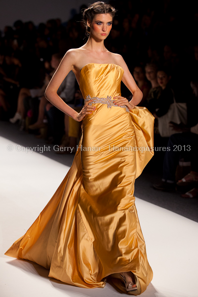 A model on the runway at the Venexiana SS2013 show at New York Mercedes-Benz Fashion Week.