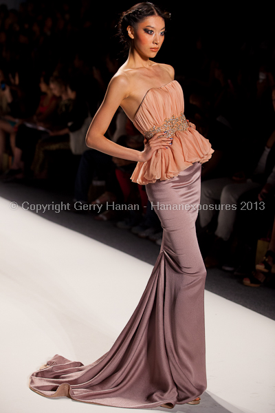 A model on the runway at the Venexiana SS2013 show at New York Mercedes-Benz Fashion Week.