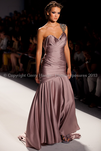 A model on the runway at the Venexiana SS2013 show at New York Mercedes-Benz Fashion Week.