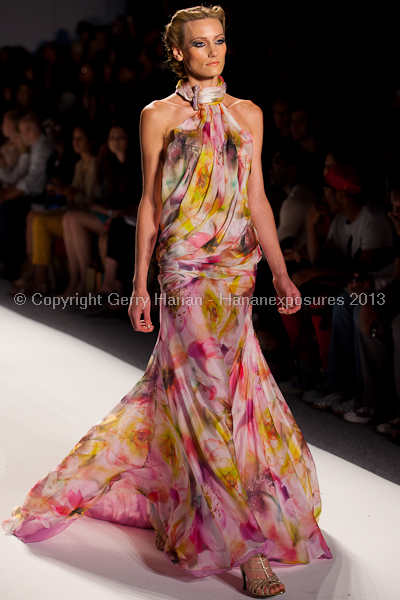 A model on the runway at the Venexiana SS2013 show at New York Mercedes-Benz Fashion Week.