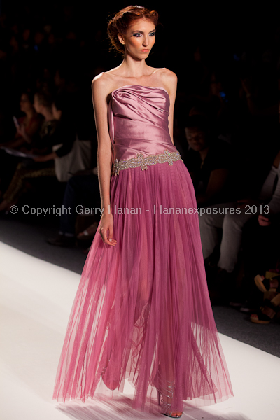 A model on the runway at the Venexiana SS2013 show at New York Mercedes-Benz Fashion Week.