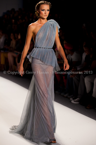 A model on the runway at the Venexiana SS2013 show at New York Mercedes-Benz Fashion Week.