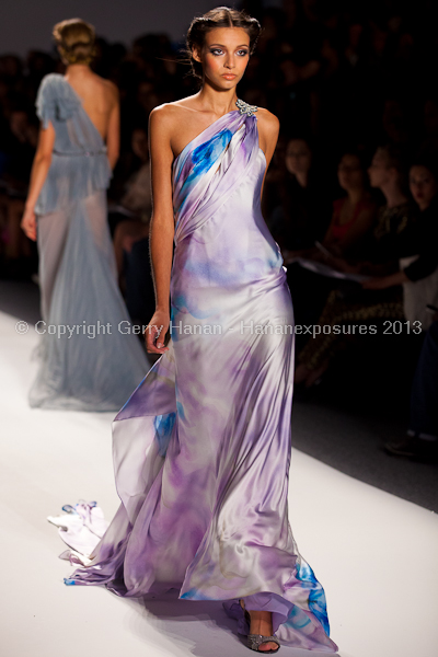 A model on the runway at the Venexiana SS2013 show at New York Mercedes-Benz Fashion Week.