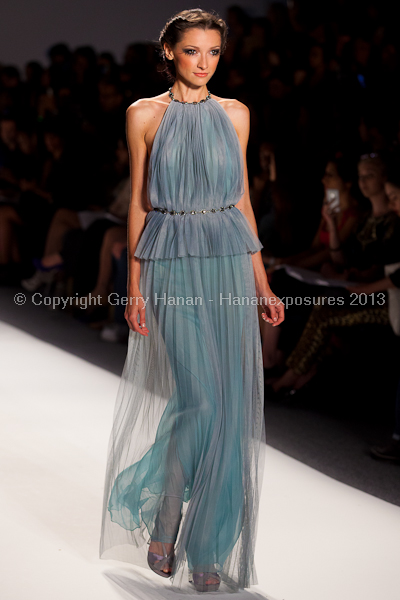 A model on the runway at the Venexiana SS2013 show at New York Mercedes-Benz Fashion Week.