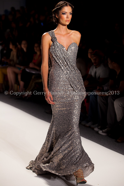 A model on the runway at the Venexiana SS2013 show at New York Mercedes-Benz Fashion Week.