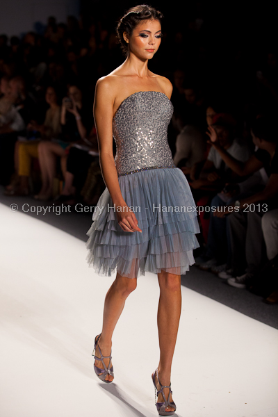 A model on the runway at the Venexiana SS2013 show at New York Mercedes-Benz Fashion Week.