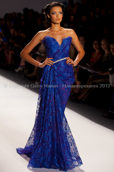 A model on the runway at the Venexiana SS2013 show at New York Mercedes-Benz Fashion Week.