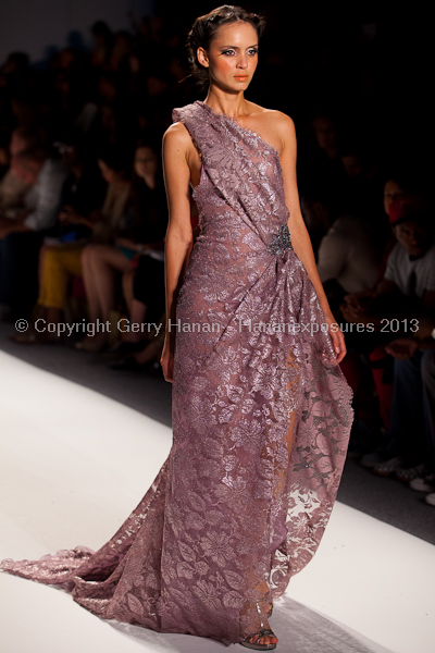 A model on the runway at the Venexiana SS2013 show at New York Mercedes-Benz Fashion Week.