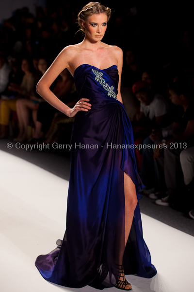 A model on the runway at the Venexiana SS2013 show at New York Mercedes-Benz Fashion Week.