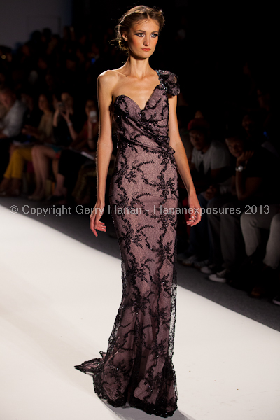 A model on the runway at the Venexiana SS2013 show at New York Mercedes-Benz Fashion Week.