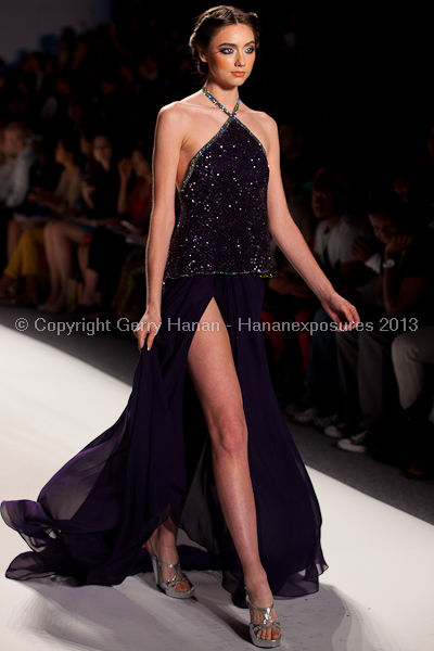 A model on the runway at the Venexiana SS2013 show at New York Mercedes-Benz Fashion Week.