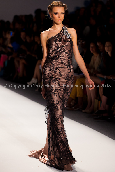 A model on the runway at the Venexiana SS2013 show at New York Mercedes-Benz Fashion Week.