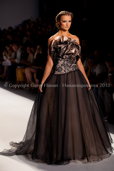 A model on the runway at the Venexiana SS2013 show at New York Mercedes-Benz Fashion Week.